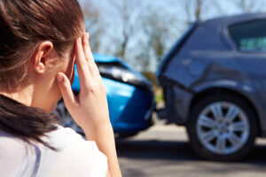 upset woman looking at accident
