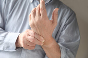 older male experiencing wrist pain